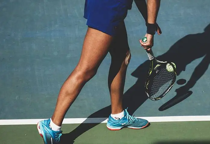 Ready to serve a tennis ball